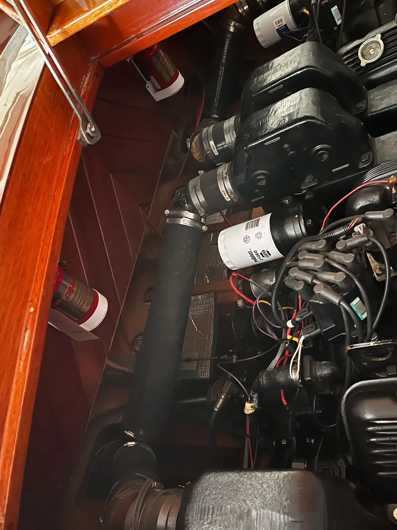 Slide: The Image of Engine compartment of a 2000 Classic Paul Dewhurst Gentleman's Racer, showcasing mechanical components and wiring. - 9