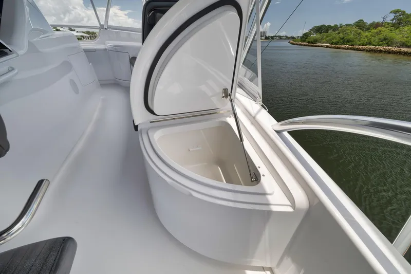 Slide: The Image of 2024 Viking 72 Convertible yacht with open storage compartment on deck. - 15
