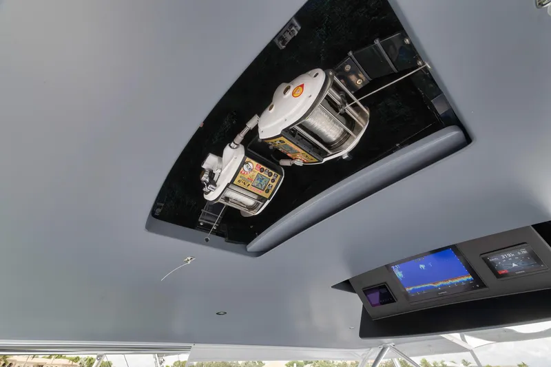 Slide: The Image of 2024 Viking 72 Convertible yacht interior with advanced fishing equipment and navigation display. - 16