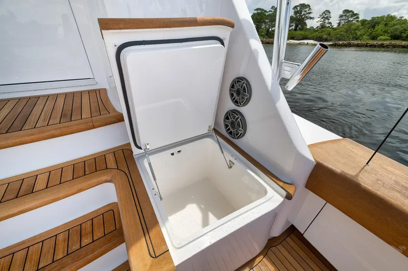 Slide: The Image of 2024 Viking 72 Convertible yacht with open storage compartment and teak deck. - 22