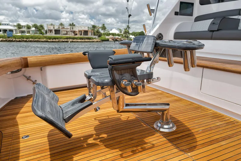 Slide: The Image of 2024 Viking 72 Convertible yacht with luxurious teak deck and fishing chair. - 28