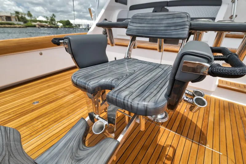 Slide: The Image of Luxury fishing chair on 2024 Viking 72 Convertible yacht, featuring sleek design and wood finish. - 29