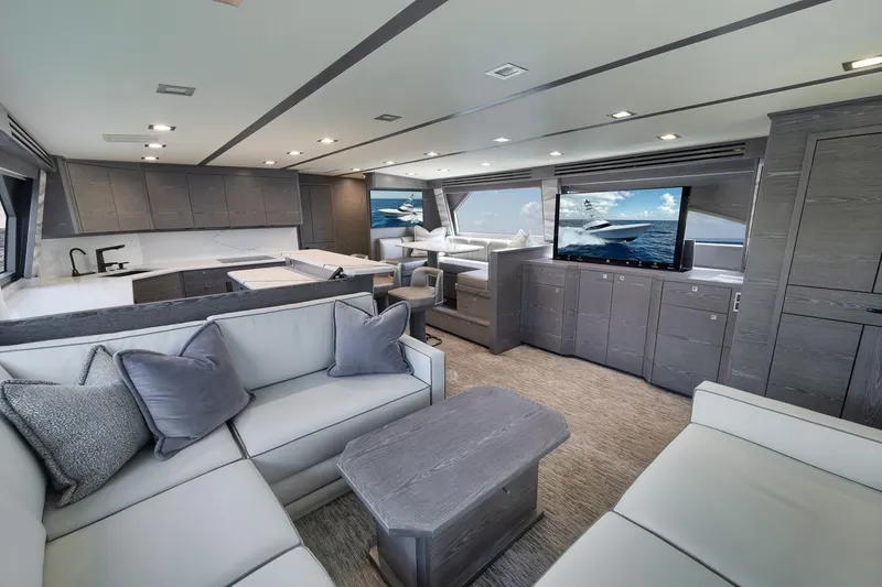 Slide: The Image of Luxurious interior of 2024 Viking 72 Convertible yacht with modern furnishings and large windows. - 37