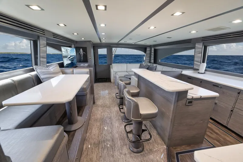 Slide: The Image of Luxurious interior of 2024 Viking 72 Convertible yacht with modern seating and ocean view. - 38