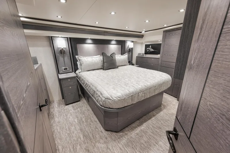 Slide: The Image of Luxurious bedroom interior of 2024 Viking 72 Convertible yacht with modern design and elegant furnishings. - 42