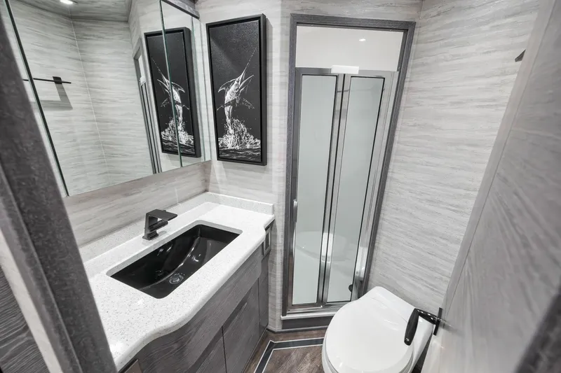 Slide: The Image of Luxurious bathroom in 2024 Viking 72 Convertible yacht with modern fixtures and elegant design. - 45