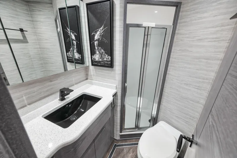 Slide: The Image of Luxurious bathroom in 2024 Viking 72 Convertible yacht, featuring modern fixtures and elegant design. - 46