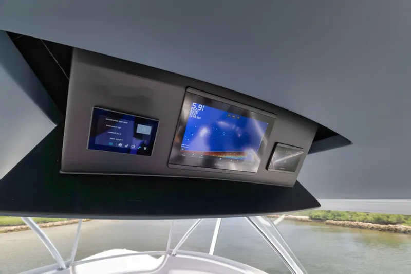 Slide: The Image of 2024 Viking 72 Convertible yacht dashboard with advanced navigation displays. - 9