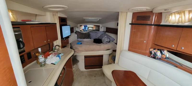 Slide: The Image of Interior of 2005 Sea Ray 320 Sundancer with cozy cabin and modern amenities. - 3