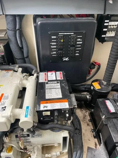 Slide: The Image of Engine room of 2005 Sea Ray 320 Sundancer with electrical panel and equipment. - 33