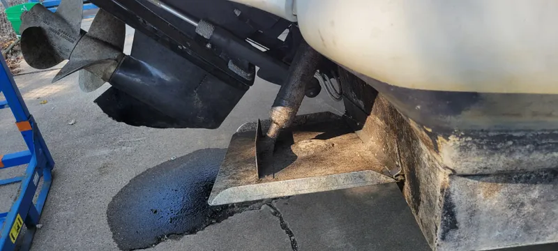 Slide: The Image of 2005 Sea Ray 320 Sundancer boat propeller and stern detail on concrete surface. - 4