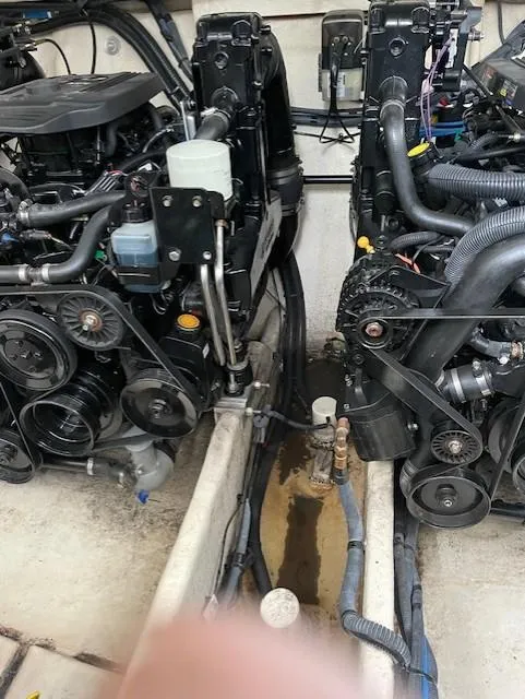 Slide: The Image of Engine compartment of a 2005 Sea Ray 320 Sundancer boat, showing dual engines and components. - 40