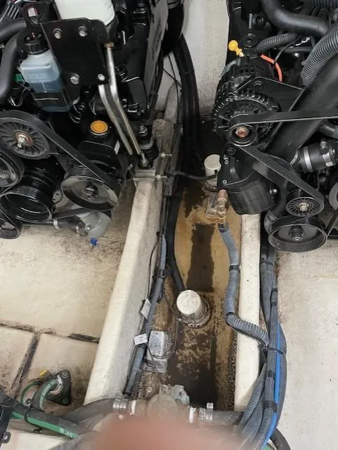 Slide: The Image of Engine compartment of a 2005 Sea Ray 320 Sundancer boat, showing dual engines and wiring. - 41