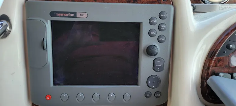 Slide: The Image of Raymarine navigation system on 2005 Sea Ray 320 Sundancer boat dashboard. - 7