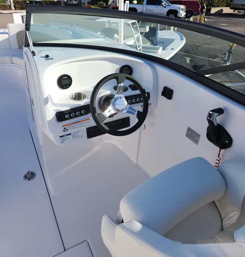 Slide: The Image of 2025 SouthWind 2600 SD boat cockpit with steering wheel and controls. - 10