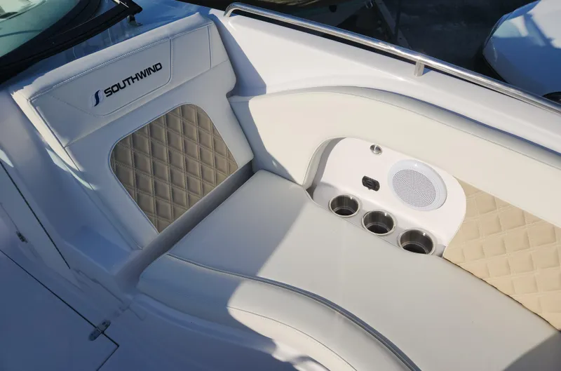 Slide: The Image of Luxurious seating on 2025 SouthWind 2600 SD boat with cup holders and speaker. - 15