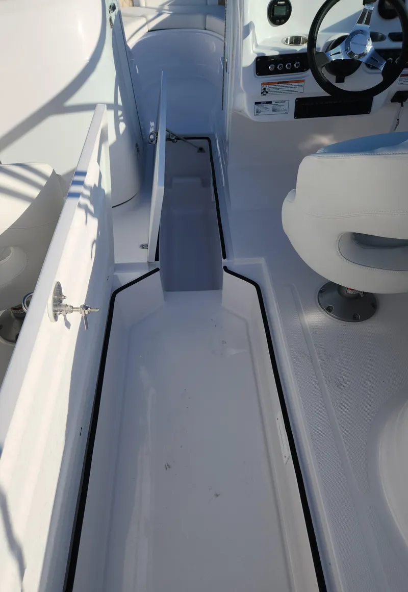 Slide: The Image of 2025 SouthWind 2600 SD boat interior with seating and steering wheel. - 18