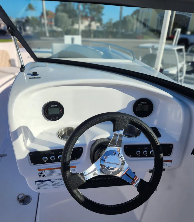 Slide: The Image of Steering wheel and dashboard of 2025 SouthWind 2600 SD boat. - 19