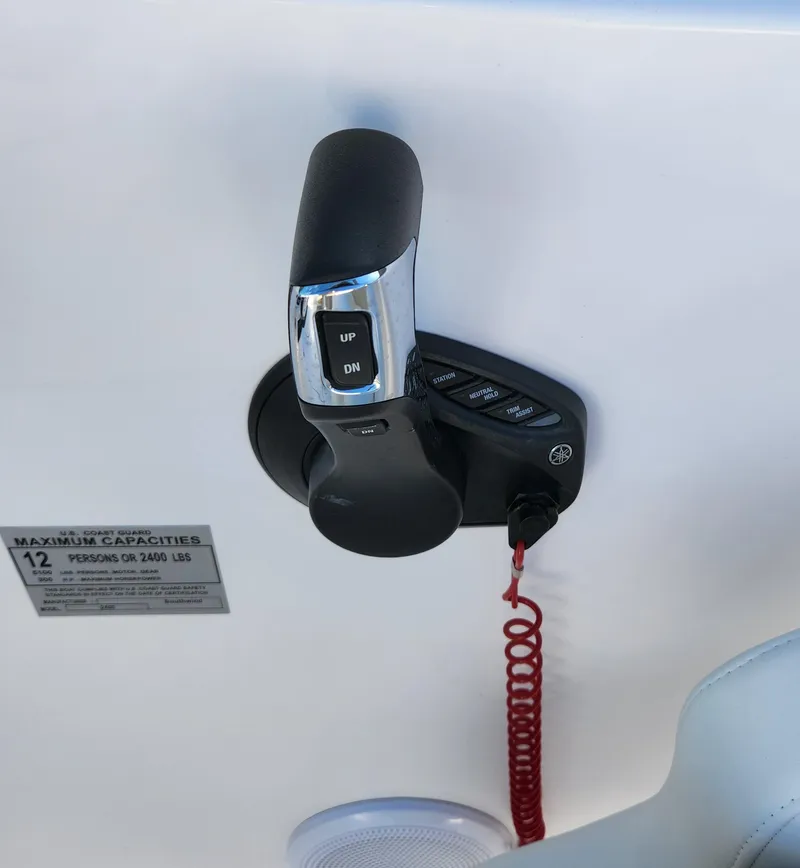 Slide: The Image of Close-up of 2025 SouthWind 2600 SD boat throttle control with capacity label. - 20