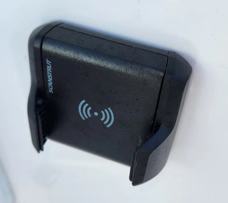 Slide: The Image of Wireless phone holder on SouthWind 2600 SD 2025 boat, featuring a sleek black design. - 21