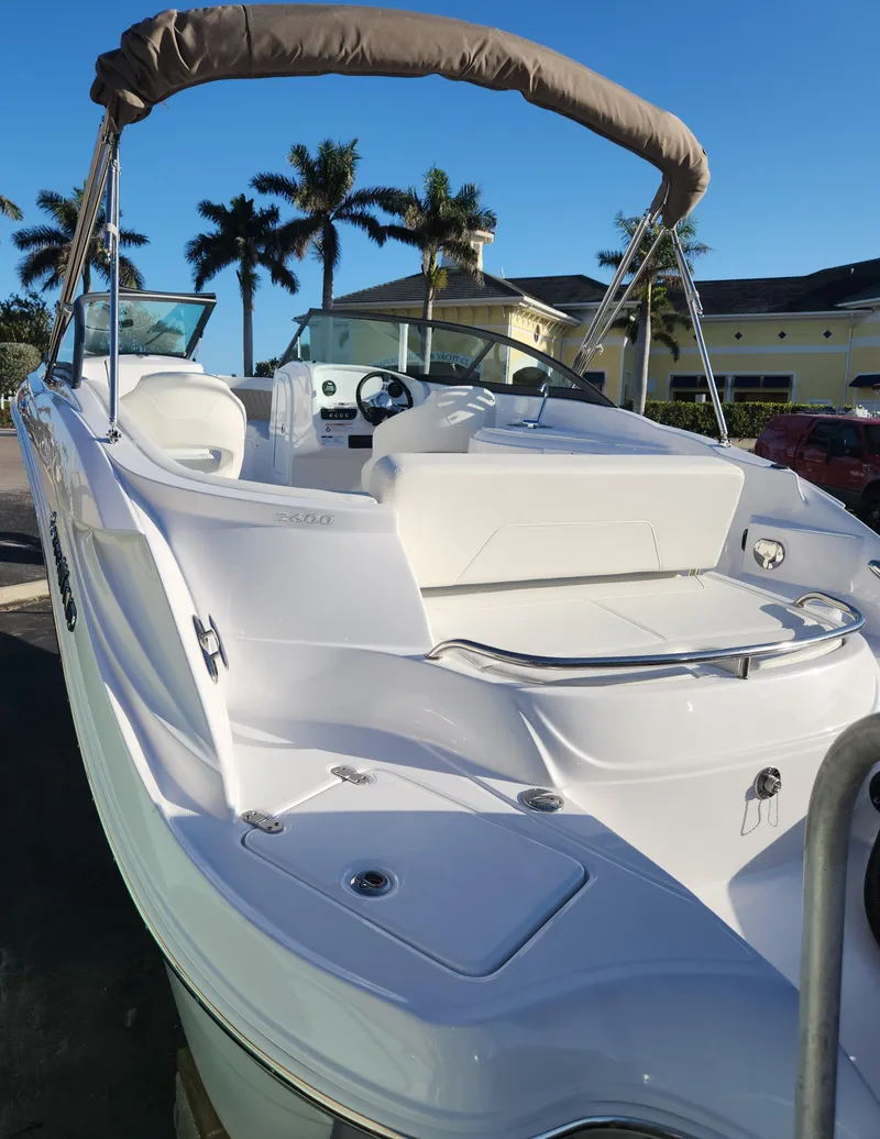 Slide: The Image of 2025 SouthWind 2600 SD boat with sleek design, white exterior, and spacious seating. - 5