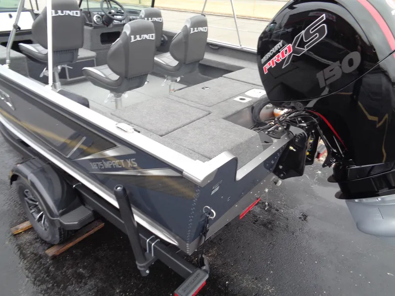 Slide: The Image of 2025 Lund 1875 Impact XS Sport boat with Pro XS 150 engine, rear view. - 11