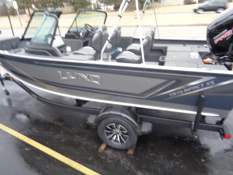 Slide: The Image of 2025 Lund 1875 Impact XS Sport boat on trailer, side view. - 5