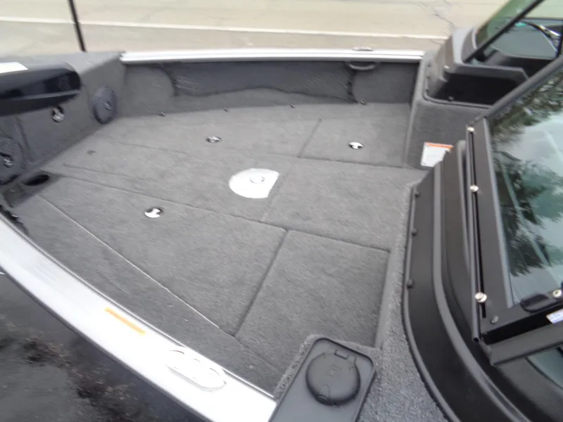 Slide: The Image of 2025 Lund 1875 Impact XS Sport boat interior with spacious deck and storage compartments. - 6