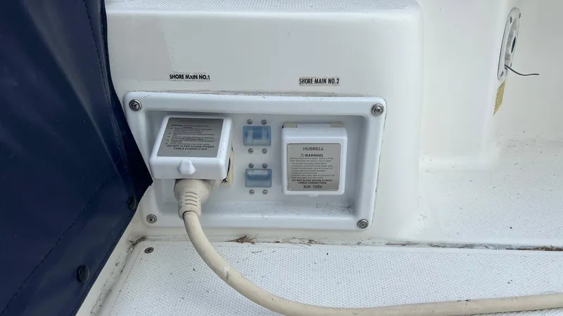 Slide: The Image of Electrical outlet panel on a 2006 Rampage 30 Offshore boat. - 10
