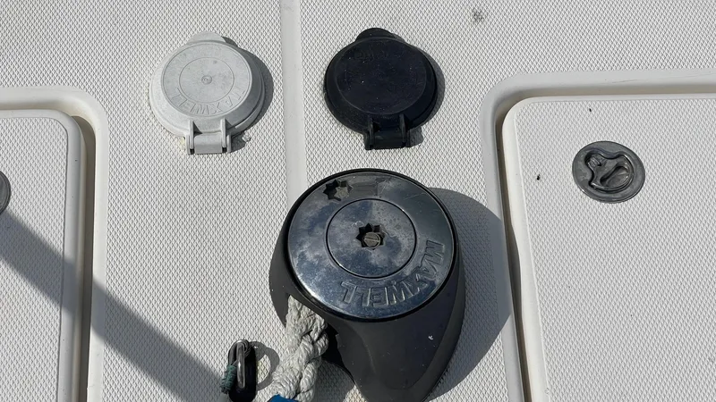 Slide: The Image of Deck fittings on a 2006 Rampage 30 Offshore boat, featuring cleats and hatches. - 11