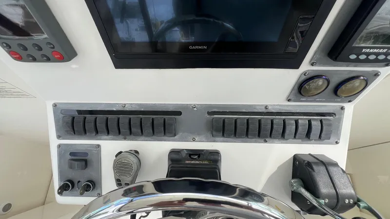 Slide: The Image of Control panel of a 2006 Rampage 30 Offshore boat with navigation equipment. - 22