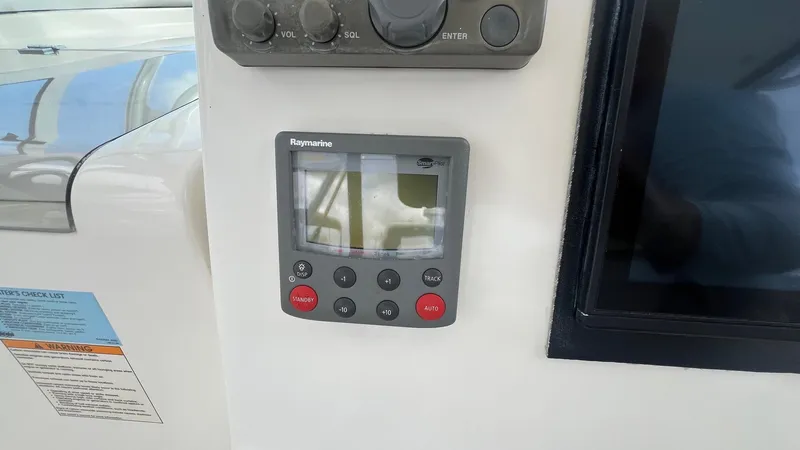 Slide: The Image of Control panel on a 2006 Rampage 30 Offshore boat dashboard. - 23