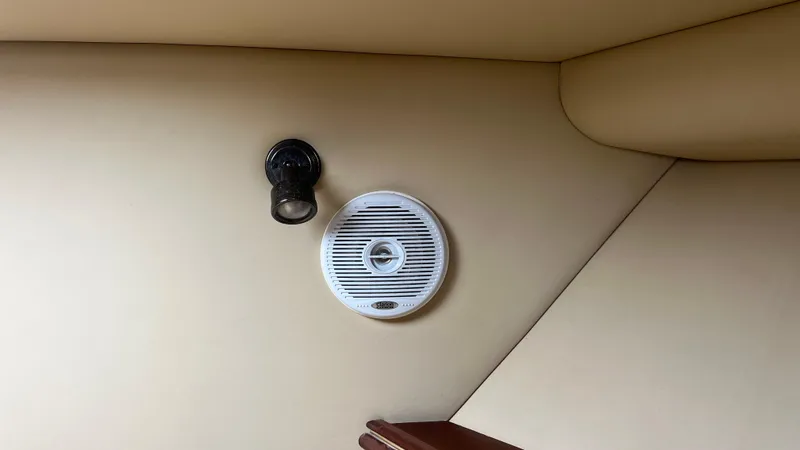 Slide: The Image of Ceiling speaker and light fixture in 2006 Rampage 30 Offshore boat interior. - 31