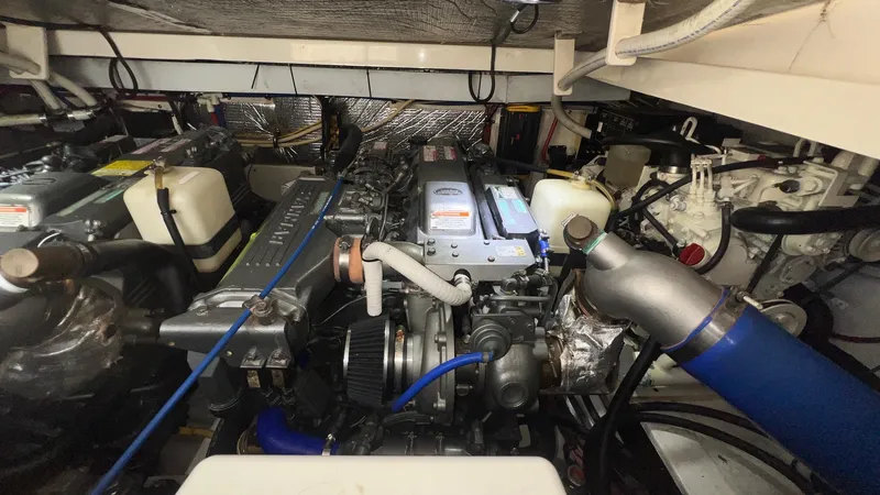 Slide: The Image of Engine room of a 2006 Rampage 30 Offshore boat, showcasing mechanical components. - 50