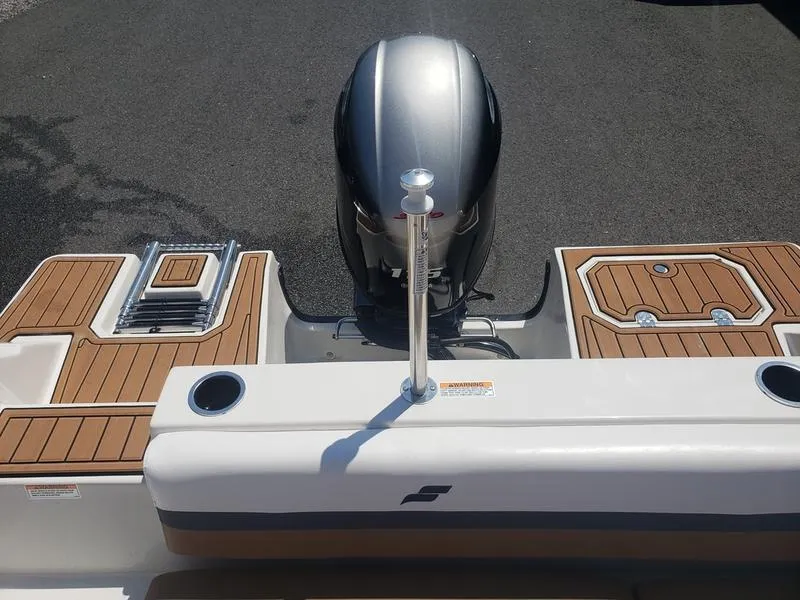 Slide: The Image of 2023 Starcraft SVX 191 OB boat with outboard motor and teak deck accents. - 10