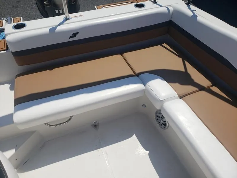 Slide: The Image of 2023 Starcraft SVX 191 OB boat interior with tan and white seating. - 13