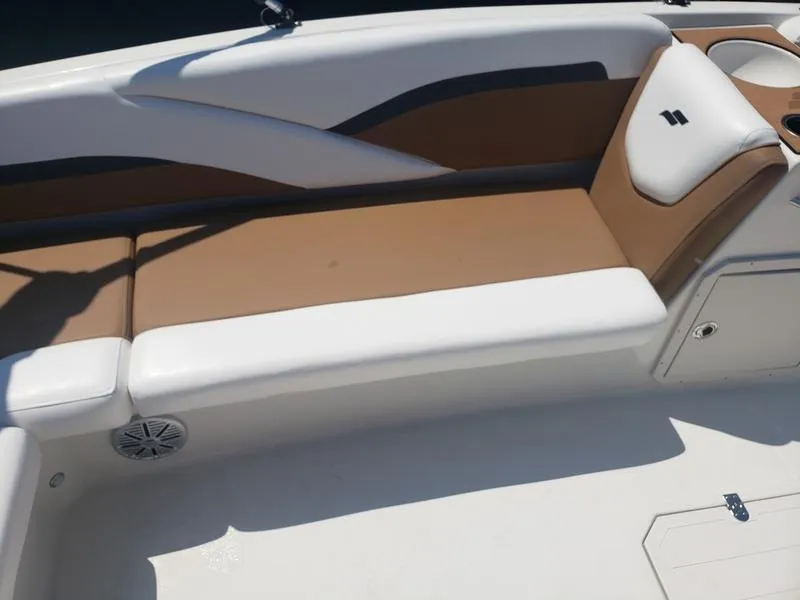 Slide: The Image of 2023 Starcraft SVX 191 OB boat interior with tan and white seating. - 14