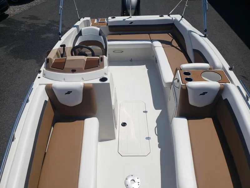 Slide: The Image of 2023 Starcraft SVX 191 OB boat interior with tan and white seating. - 15