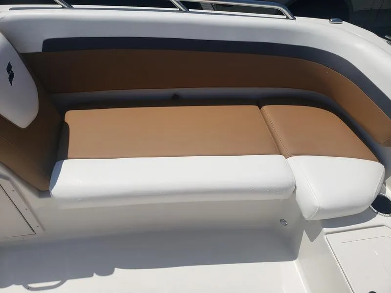 Slide: The Image of 2023 Starcraft SVX 191 OB boat seating with tan and white upholstery. - 17