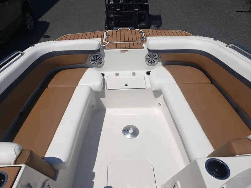 Slide: The Image of 2023 Starcraft SVX 191 OB boat interior with tan and white seating. - 18