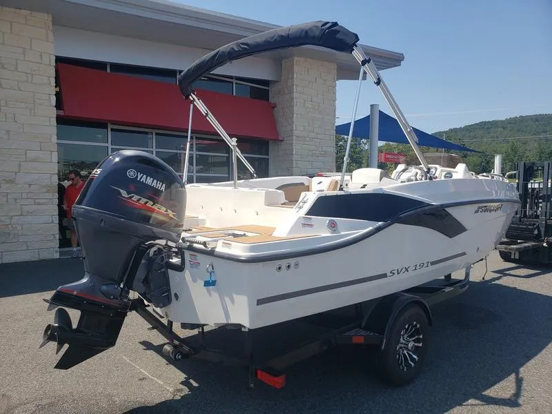 Slide: The Image of 2023 Starcraft SVX 191 OB boat with Yamaha outboard motor, parked outdoors. - 6