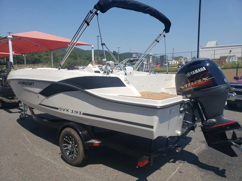 Slide: The Image of 2023 Starcraft SVX 191 OB boat with Yamaha engine on trailer, outdoor display. - 7