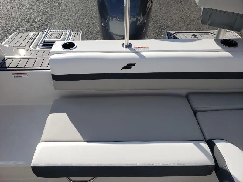 Slide: The Image of 2024 Starcraft SVX 190 OB boat interior with cushioned seating and cup holders. - 12