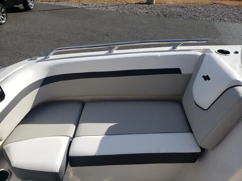 Slide: The Image of 2024 Starcraft SVX 190 OB boat interior seating with sleek design and comfortable cushions. - 16