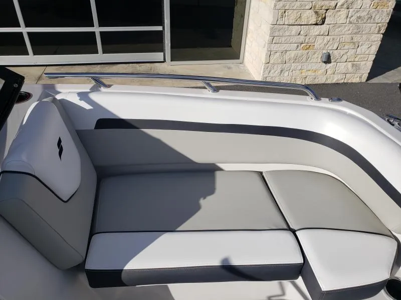 Slide: The Image of 2024 Starcraft SVX 190 OB boat interior with gray and white cushioned seating. - 18