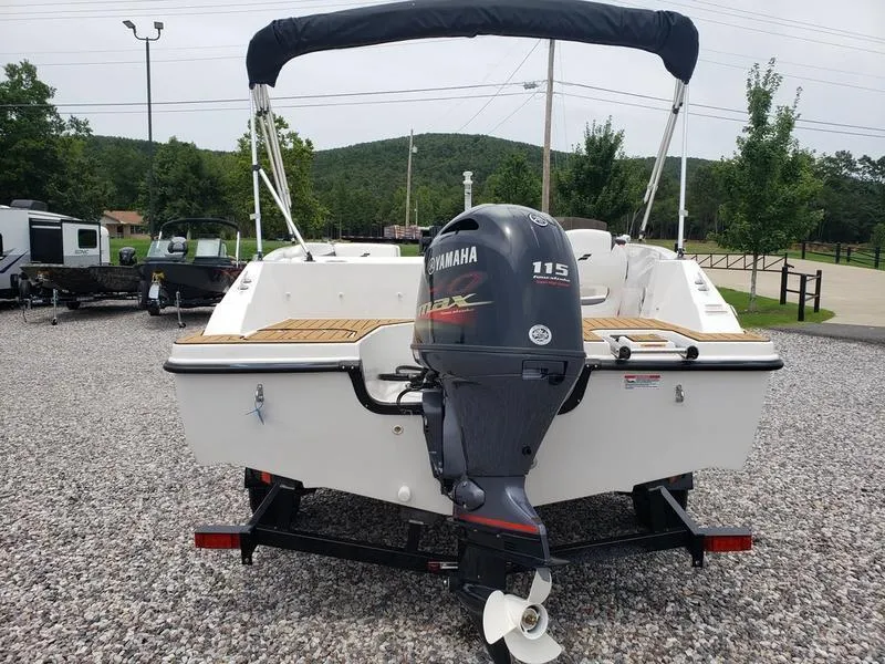 Slide: The Image of 2023 Starcraft SVX 171 OB boat with Yamaha 115 engine, parked on gravel. - 13