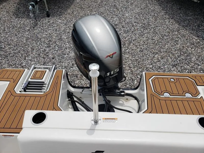 Slide: The Image of 2023 Starcraft SVX 171 OB boat with Yamaha 115 outboard motor, featuring teak-style decking. - 3