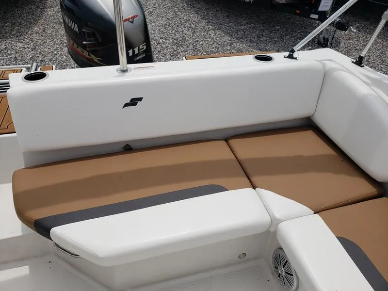 Slide: The Image of 2023 Starcraft SVX 171 OB boat interior with tan seating and Yamaha 115 outboard motor. - 5