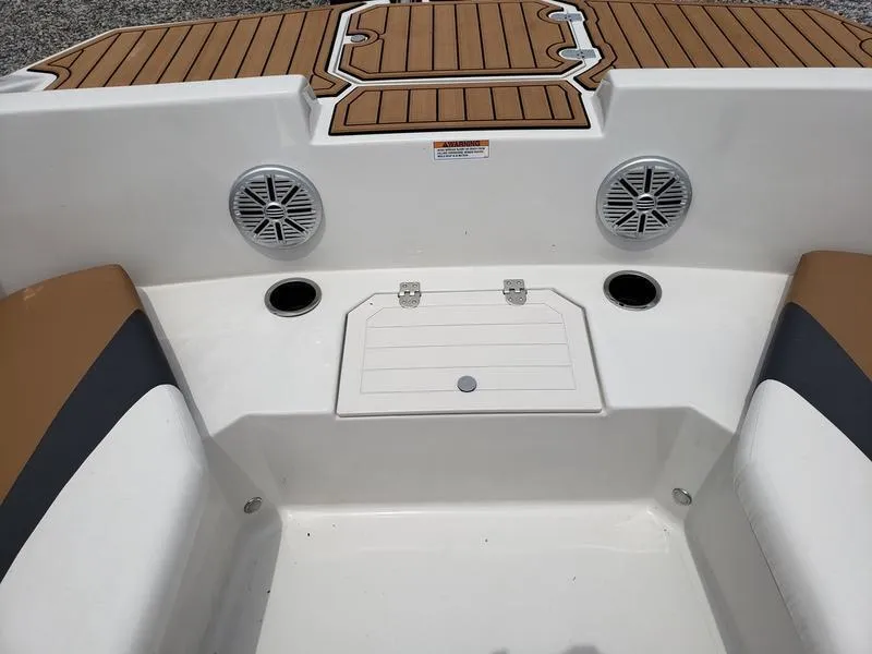 Slide: The Image of 2023 Starcraft SVX 171 OB boat interior with speakers and seating area. - 8