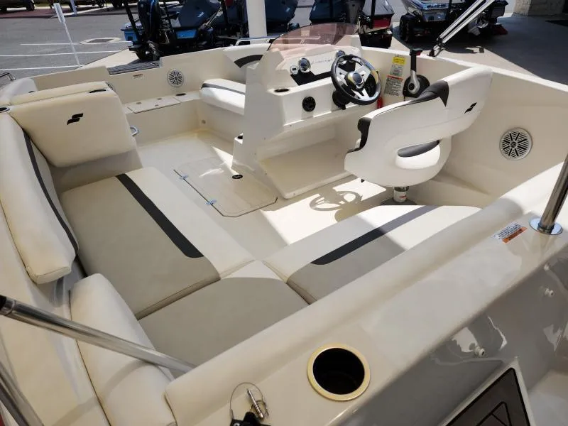 Slide: The Image of 2024 Starcraft SVX 171 OB boat interior with seating and steering console. - 10